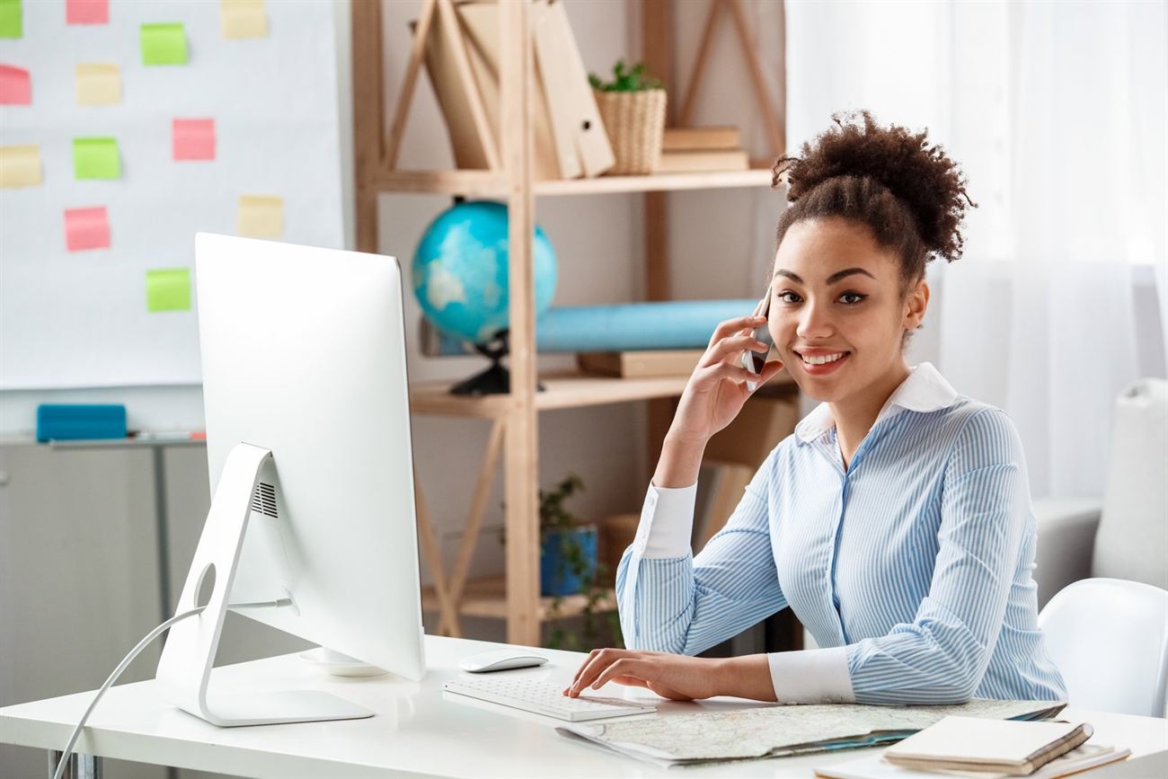 Venture Ashore team member on a call with a travel advisor